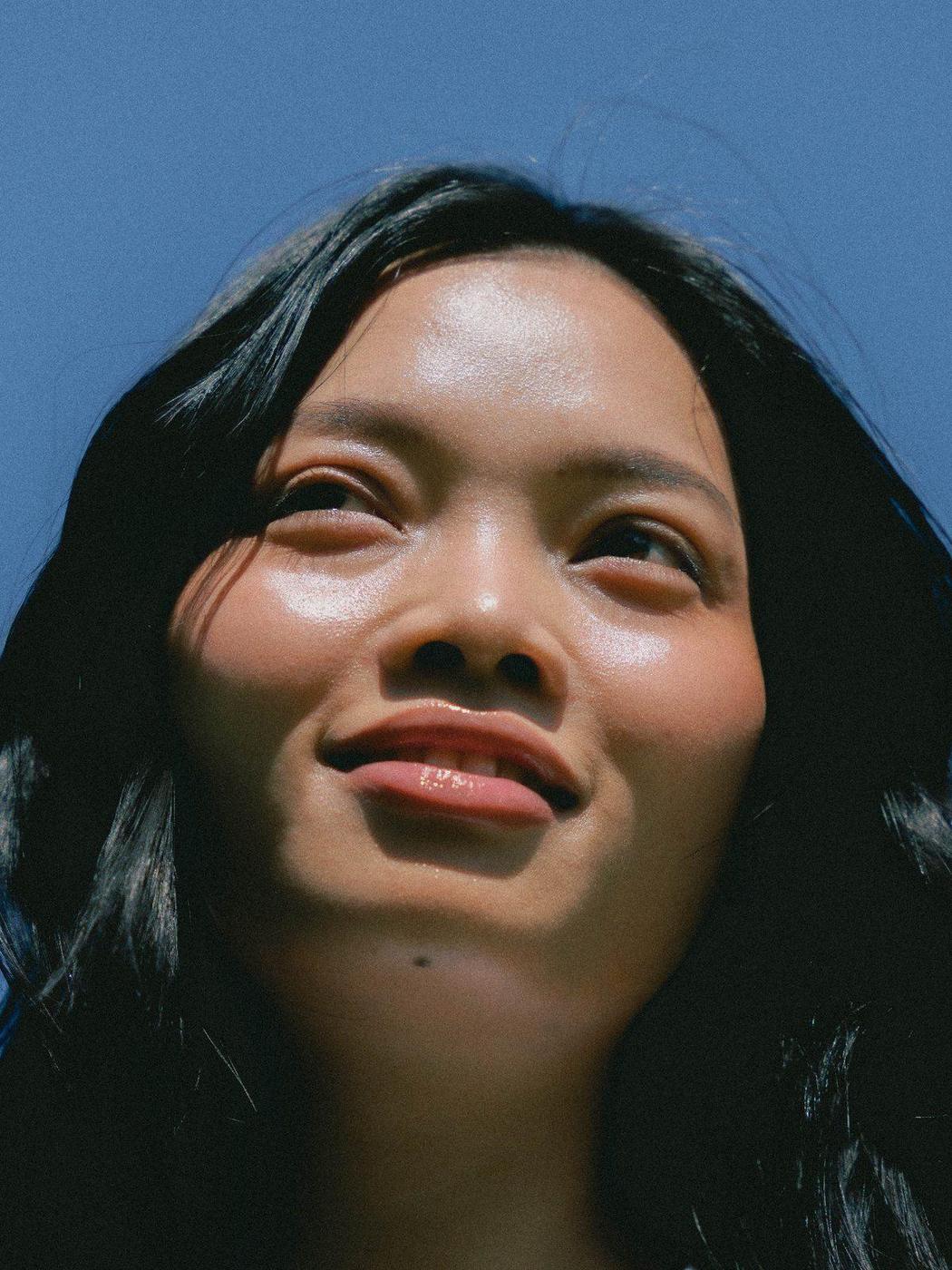 A relaxed, glowing smile in natural light