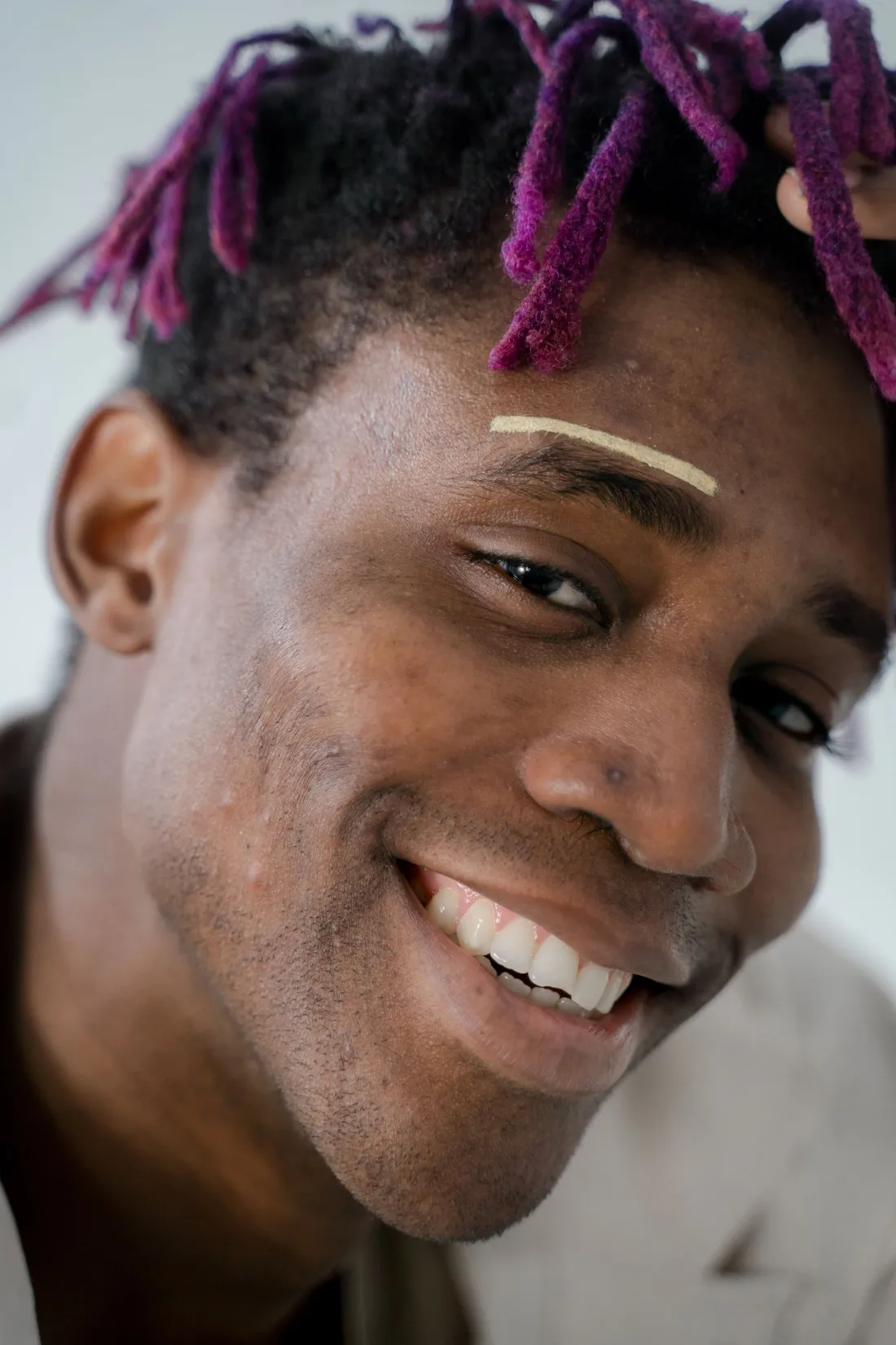 A warm smile with real, honest skin