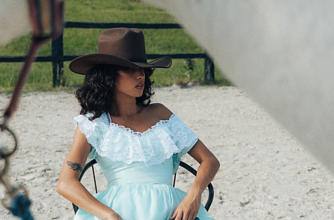 A cowgirl in lace with porcelain skin, Texas chic