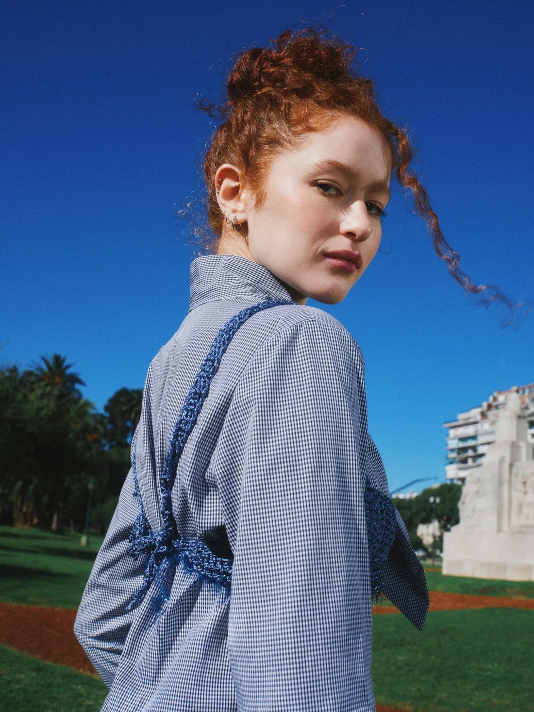 Fresh, porcelain-clear skin against a blue sky