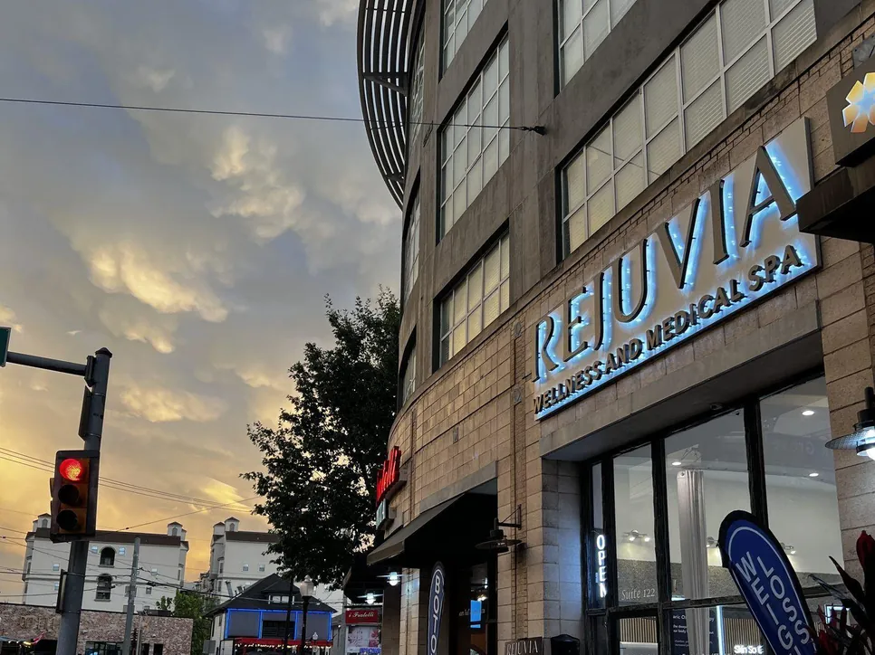 The Rejuvia storefront on Allen Street at dusk