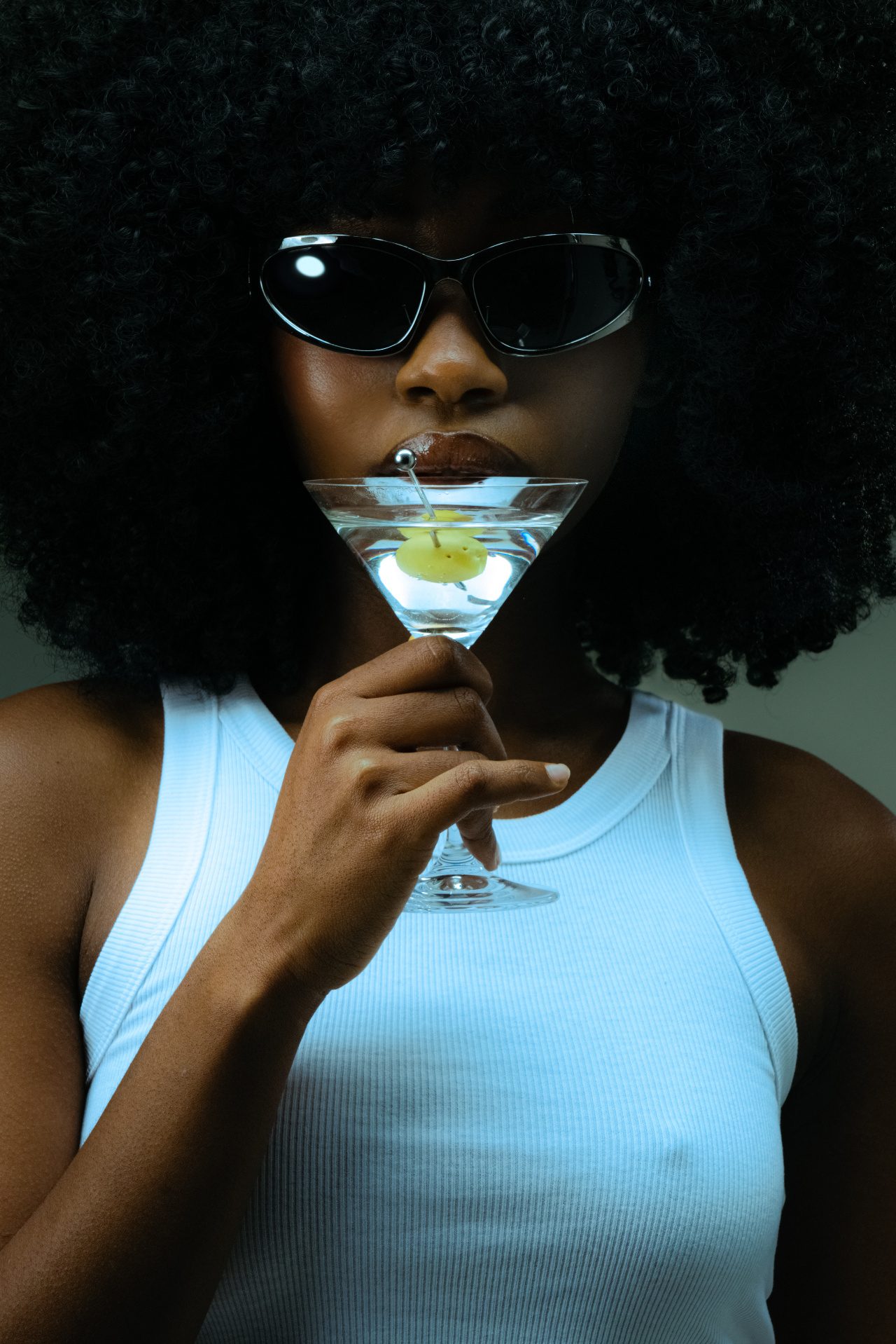 Woman in sunglasses holding a martini glass &mdash; Happy Hour at Rejuvia Wellness and Medical Spa in Uptown Dallas